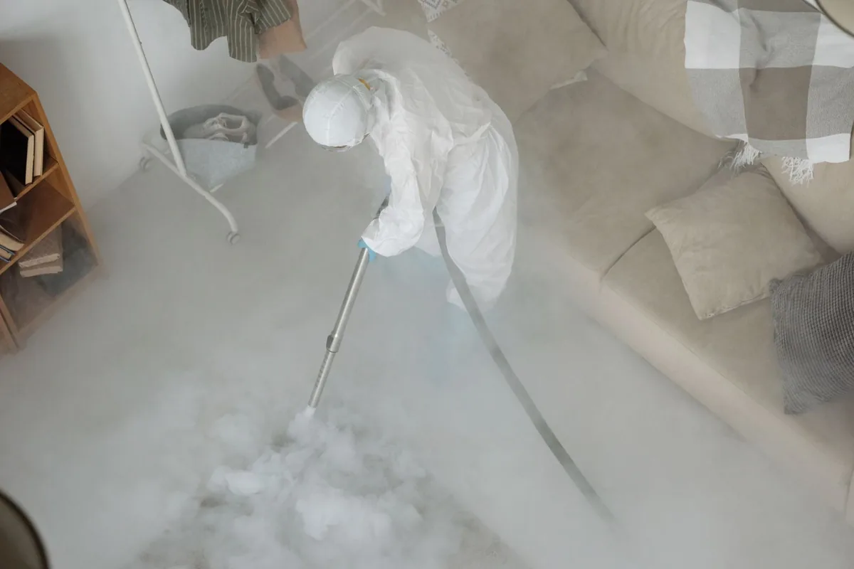 Biohazard cleanup technician in protective equipment, Reed Creek, GA
